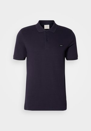 Marineblauwe polo gemaakt van katoen, met een klassieke kraag, een twee-knopen placket, korte mouwen en een klein logo op de borst.