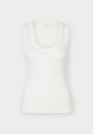 Débardeur blanc côtelé sans manches avec encolure dégagée, présenté à plat sur un fond blanc.