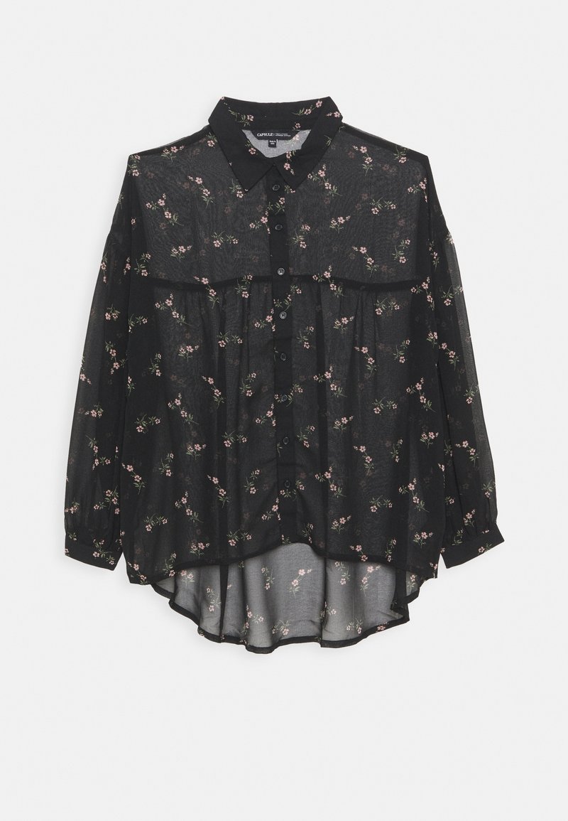 Schwarzes, transparentes Langarmshirt mit floralem Muster, Knopfleiste vorne und längerem Saum hinten. Mit Kragen und lockerem Schnitt.