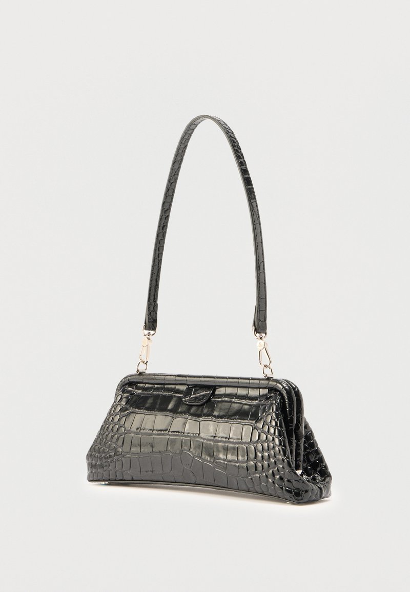 Black croc-embossed leather shoulder bag with a structured frame and a long detachable strap against a plain white background.