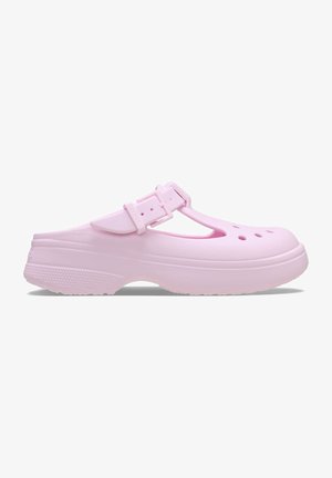 Pink clogs made of molded plastic, featuring a T-strap design, side vents, and textured outsole for grip. Lightweight construction.
