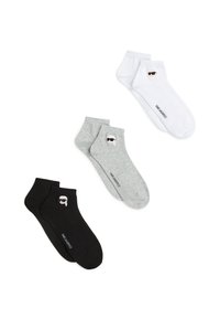 Tres pares de calcetines tobilleros en algodón negro, gris y blanco. Cada uno presenta una cara impresa con gafas de sol y una marca en el costado.