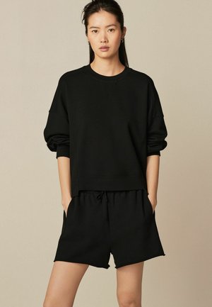 Next RAW EDGE REGULAR FIT - Lühikesed püksid - black