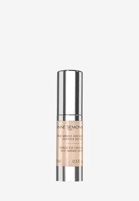 Crema para los ojos en un elegante frasco plateado y beige, con una tapa suave y etiquetado con los detalles del producto. Capacidad: 15 ml (0.5 fl. oz.).