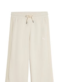 Pantalon de survêtement crème avec taille élastique, fermeture par cordon de serrage, poches latérales, et petit logo Puma sur la cuisse gauche.