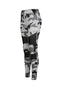 Szürke és fekete kamuflázs leggings, magas derékkal és hálós panelek használatával, rugalmas, sima anyagból készült a kényelem és mozgás szabadsága érdekében.