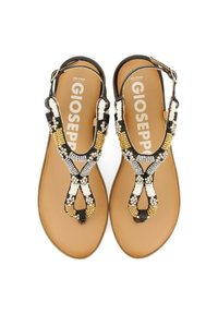 Sandalias con cuentas y diseño de tira en T. Presenta cuentas en negro, blanco y dorado, y una suela de goma marrón. Incluye una tira ajustable en el tobillo.