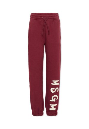 Pantaloni della tuta bordeaux con cintura elasticizzata e cordino, con il testo "MSGM" color crema stampato verticalmente sulla gamba sinistra.