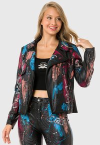 Black leather biker jacket featuring colorful splatter paint designs in pink and blue. The design also includes silver accents on the jacket.