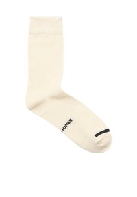 Roomkleurige katoenen sok met geribbelde boord, met zwarte tekst "JONES" en een zwarte streep bij de teen.