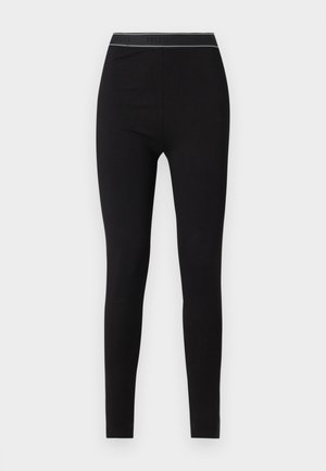 Leggings noirs en matériau extensible, avec un design ajusté et une ceinture gaufrée avec logo dans une couleur contrastante.
