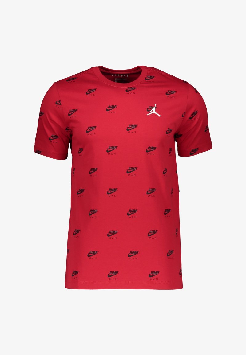 Camiseta de algodón roja con mangas cortas, que presenta un patrón repetido de logotipos negros "JUMP MAN" y un emblema Jumpman blanco en el pecho.