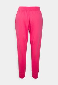 Rosa sweatpants med elastisk midja och muddar, tillverkade av mjukt tyg. Har sidofickor och en jämn yta genom hela materialet.