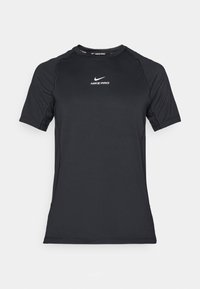 Sortermet Nike Pro idrettskomprimeringsskjorte i svart med hvit Nike-logo sentrert på brystet.