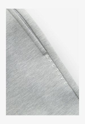 Gray activewear fabric featuring a smooth, textured surface with a subtle mottled pattern. The word "ACTIVE" is printed in white along the side.