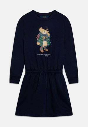 Robe à manches longues bleu marine avec taille élastique et cordon de serrage, ornée d'un ours en peluche portant un manteau à carreaux, une jupe et un béret sur le devant.