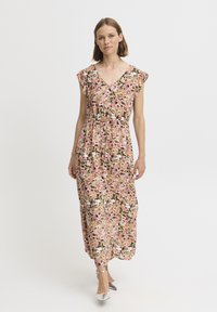 Blomster midi kjole i pink, creme og grøn, med korte flæseærmer, V-hals og en justerbar snøre i taljen.