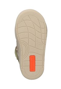 Tan rubberen zool met gestructureerde patronen, met een oranje rechthoekige accent waarop "BUNNIES JR." is vermeld. De zool heeft een afgeronde vorm.