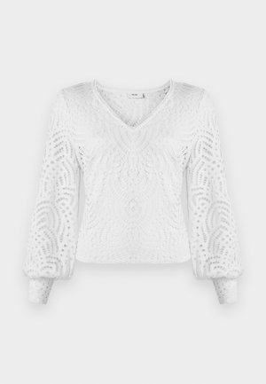 Valge pullover-top, millel on V-kaelus, pikad puffvarrukad ja keeruline pitsilaadne muster, millel on lõike-detailid. Tekstuuriga, kerge kangas.