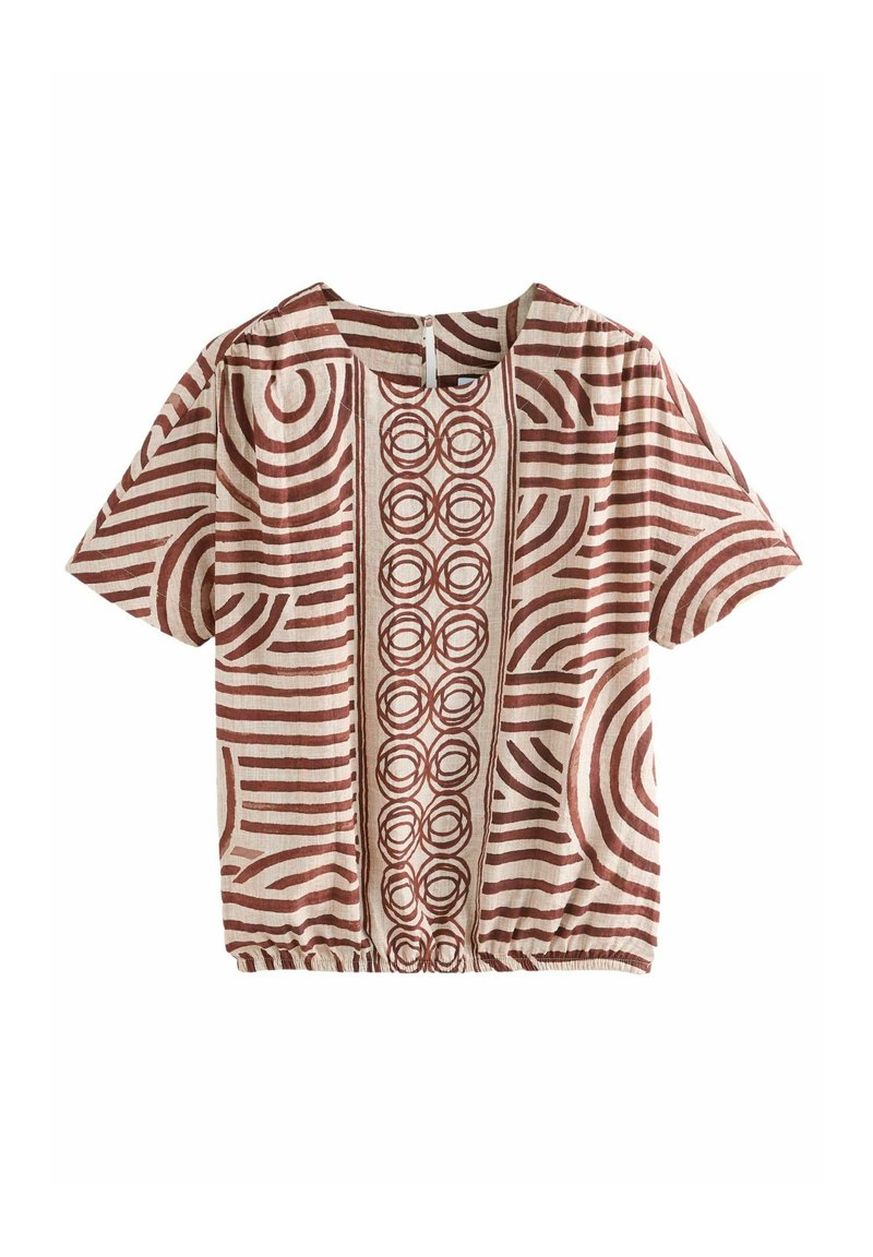Katoenen top met korte mouwen in een beige basis, voorzien van rode abstracte patronen, waaronder strepen en cirkels, en een geplooide zoom.