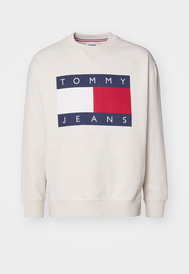 Sweat-shirt beige clair à col rond avec le logo Tommy Jeans bleu marine, blanc et rouge centré sur le devant.