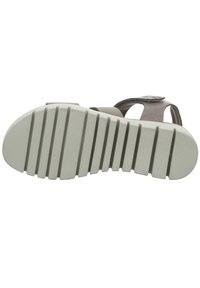 Sandal with a grey and tan upper, featuring cutouts and a textured surface. The white rubber sole has prominent horizontal grooves for grip.