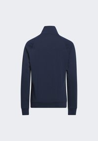 Sweatshirt bleu marine avec col montant, manches longues, poignets côtelés et un tissu lisse et texturé. Design classique à enfiler.