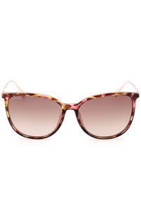 Gafas de sol de carey con una amplia forma de ojo de gato, lentes graduales y brazos delgados y transparentes. La montura presenta tonos cálidos de marrón y ámbar.