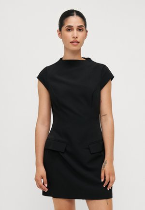 Black fitted dress with cap sleeves, high neckline, and front pockets. Made from smooth fabric, featuring clean lines and minimalistic design.
