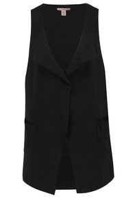 Chaleco sin mangas negro con cuello con muescas, dos bolsillos frontales y un ajuste relajado. Fabricado en un tejido suave y ligero.