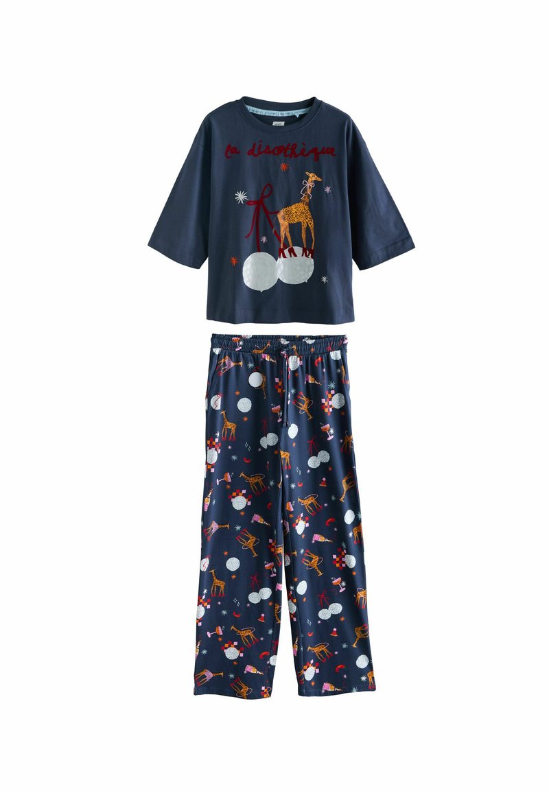 Navy cotton pajama set featuring a short-sleeve shirt with a giraffe graphic and contrasting red text, and patterned pants with festive designs.