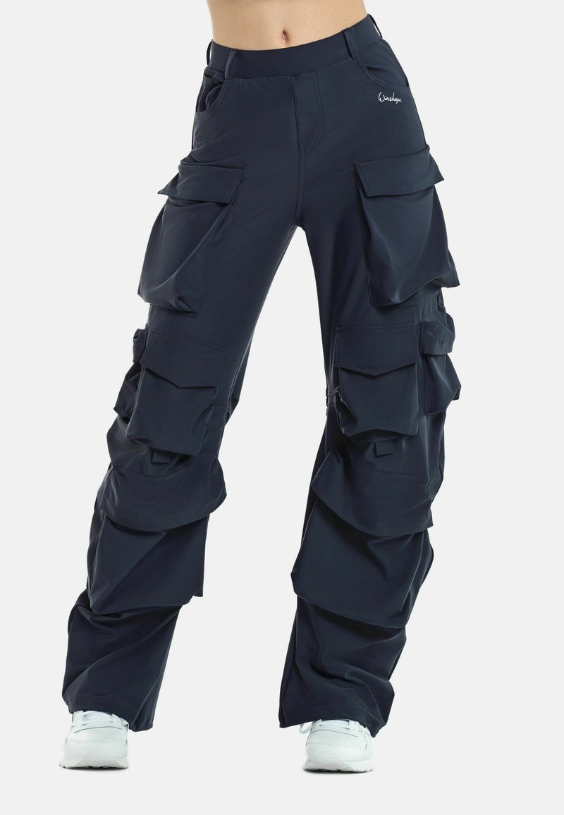 Navy cargo pants with multiple pockets, made from a lightweight, textured fabric. Features layered design and elastic waist.