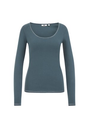 Top fitted a maniche lunghe colore teal con scollatura a giro e cuciture visibili sul colletto, sui polsini e sull'orlo, su uno sfondo bianco.