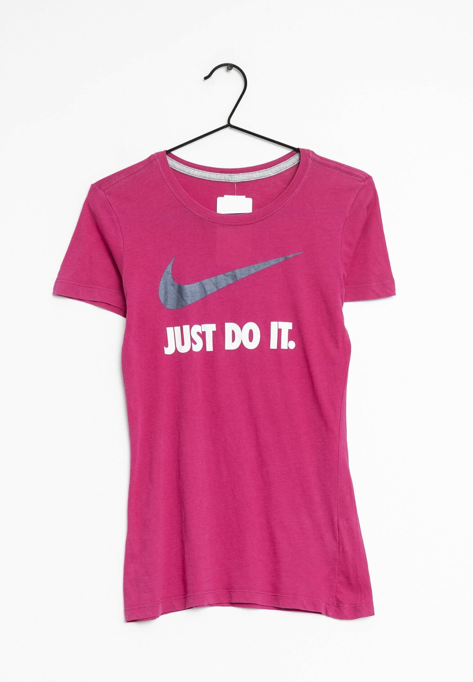 white and pink nike shirt