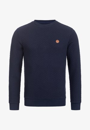 Marineblauer, strukturierter Pullover mit Rundhalsausschnitt und langen Ärmeln, mit gerippten Bündchen und Saum, ausgestattet mit einem kleinen runden beigen Logopatch auf der linken Brust.