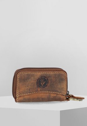 Brown leather wallet featuring a zip closure, embossed logo detail, and contrasting stitching. Compact rectangular shape with a textured finish.