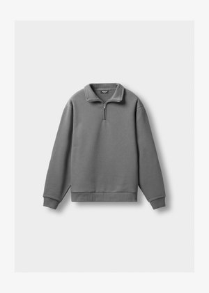 Gray fleece pullover with a quarter-zip collar, ribbed cuffs, and hem. Features a smooth texture and a minimalistic design.