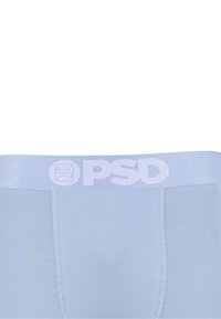 Boxers pour hommes bleu clair avec une large taille arborant le logo blanc PSD centré à l'avant.