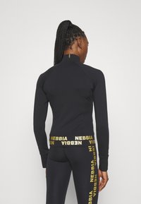 Nebbia NEBBIA WOMEN'S ZIP-UP JACKET INTENSE WARM-UP - Treningsjakke - black/gold