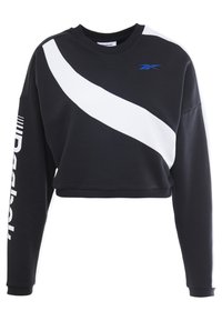 Sweat-shirt noir court avec une bande diagonale blanche et le logo Reebok bleu. Comprend des manches longues et un texte blanc sur le côté. Tissu doux au toucher.