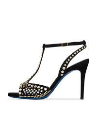Sandalo alto in suede nero con tacco, caratterizzato da un design a T-strap decorato con varie gemme trasparenti e dettagli dorati, con una suola blu.