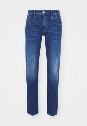 Dark blue denim jeans with a straight fit. Features five pockets, a button closure, and subtle fades on the thighs for texture.