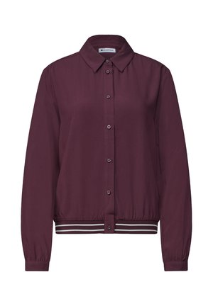 Chemise à manches longues violet foncé avec boutons, col et taille élastique avec deux bandes blanches sur fond blanc.