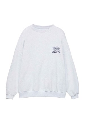 Sweat-shirt gris clair à col rond avec un petit homard bleu marine et le texte "Greetings from the sea" sur la poitrine gauche.