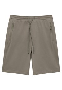 Shorts légers kaki avec une taille élastique. Comprend deux poches latérales zippées et une fermeture à cordon de serrage. Texture lisse, design décontracté.