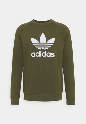 Sweat-shirt Adidas vert olive à manches longues avec logo trèfle blanc et texte "adidas" sur le devant, poignets et ourlet côtelés.