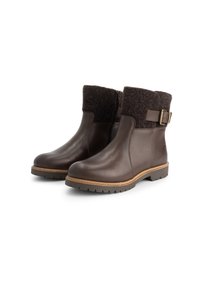 Bruine leren enkellaarsjes met een wollige bruine textielboord, rits aan de zijkant, stevige rubberen zool en decoratieve gespaccents.