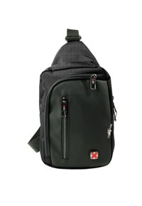 Eén-schouder sling bag in donker groen en zwarte stof, met ritssluitingen, verstelbare band en logo-detail.