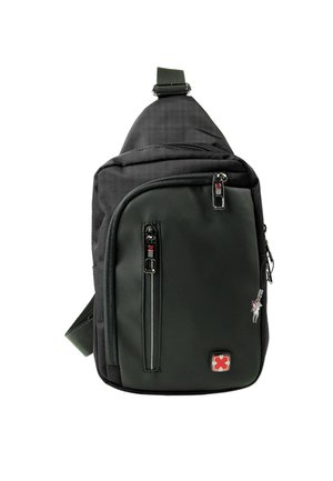 Single-strap sling bag in dark green and black fabric, featuring zippered compartments, adjustable strap, and logo detail.