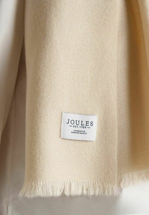 Schal aus cremefarbenem Wollmischgewebe mit Fransen an den Kanten, rechteckige Form und sichtbarem weißen Etikett mit der Aufschrift "JOULES EST. 1989."